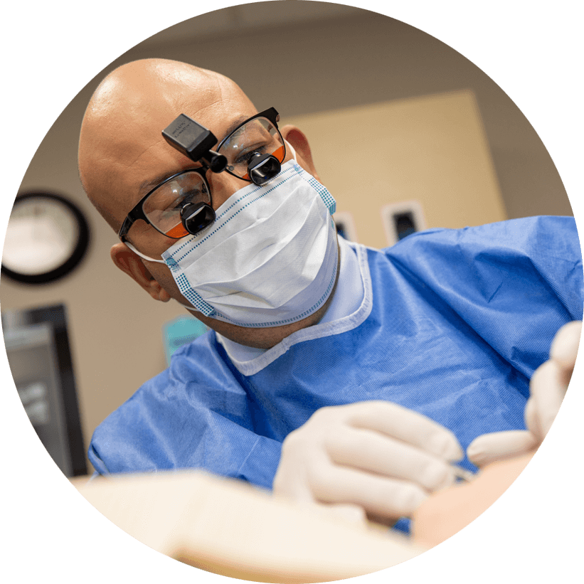 dr hanna performing dental procedure