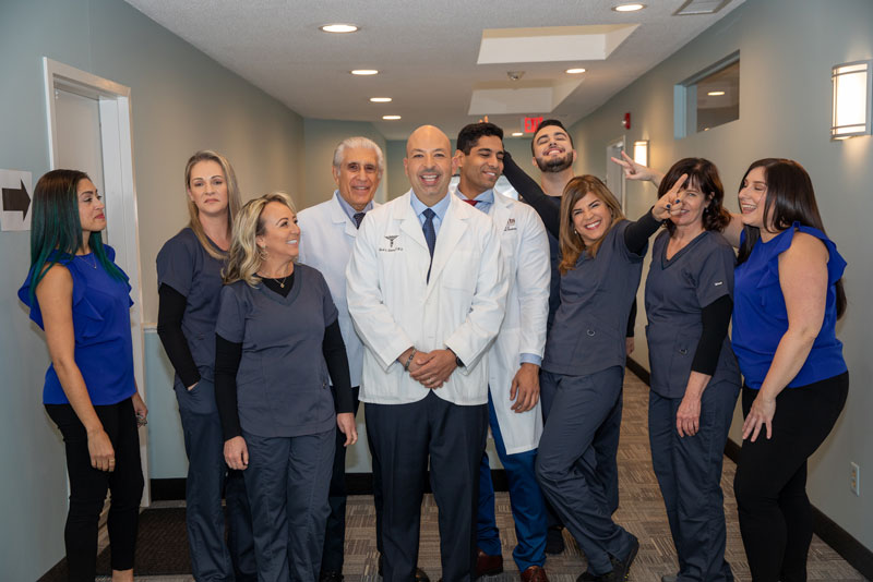 Grace Dental team smiling in hallway